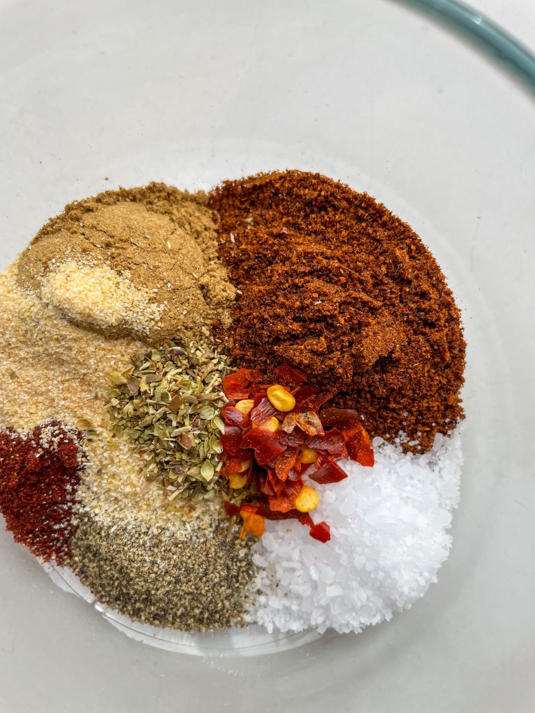 Easy homemade taco seasoning spices in a glass bowl.