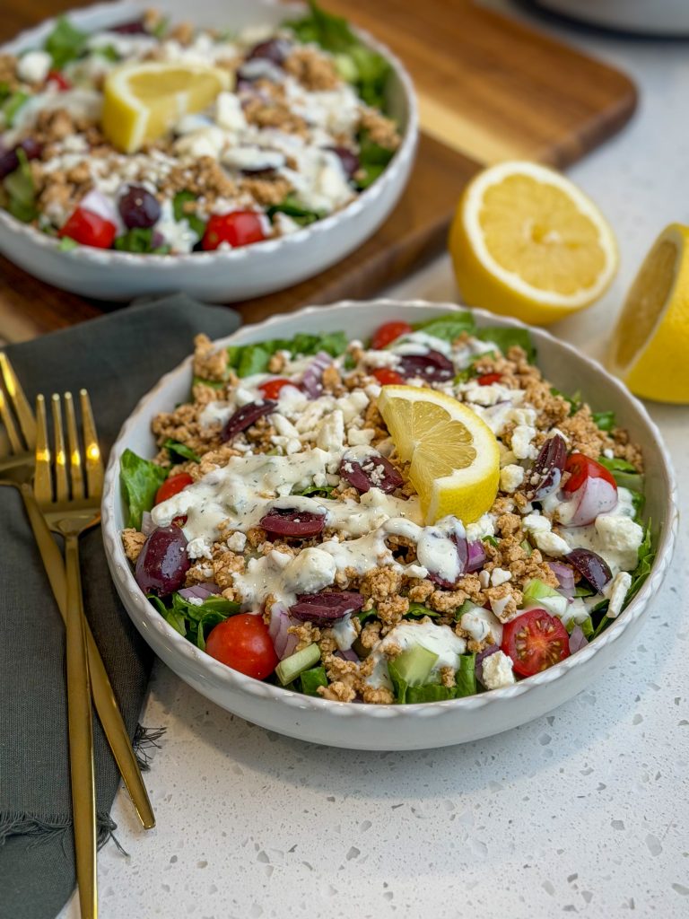 Mediterranean ground turkey salad bowls with fresh lemon wedges.